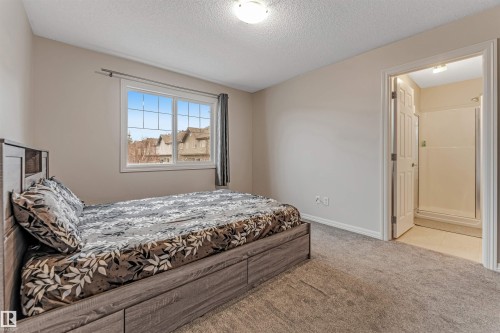 #10 5101 Soleil Bv, Beaumont, AB - Indoor Photo Showing Bedroom