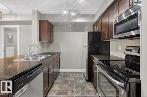 #213 5390 Chappelle Rd Sw, Edmonton, AB - Indoor Photo Showing Kitchen With Double Sink