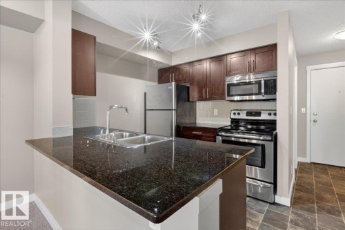 #213 5390 Chappelle Rd Sw, Edmonton, AB - Indoor Photo Showing Kitchen With Double Sink
