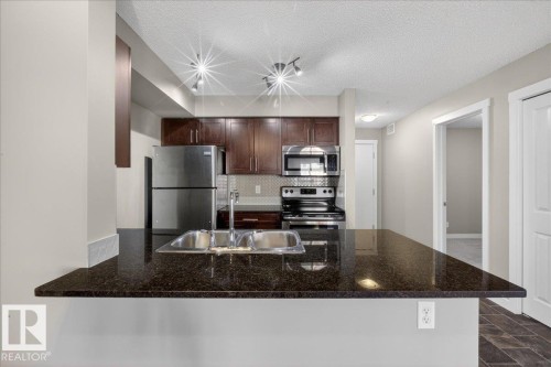 #213 5390 Chappelle Rd Sw, Edmonton, AB - Indoor Photo Showing Kitchen With Double Sink With Upgraded Kitchen