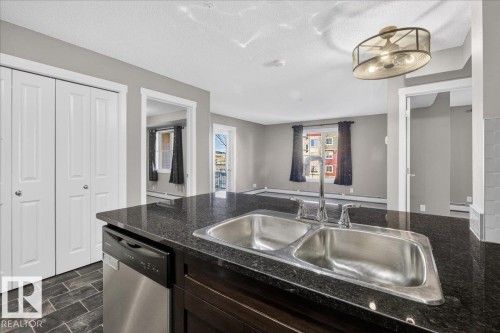 #213 5390 Chappelle Rd Sw, Edmonton, AB - Indoor Photo Showing Kitchen With Double Sink