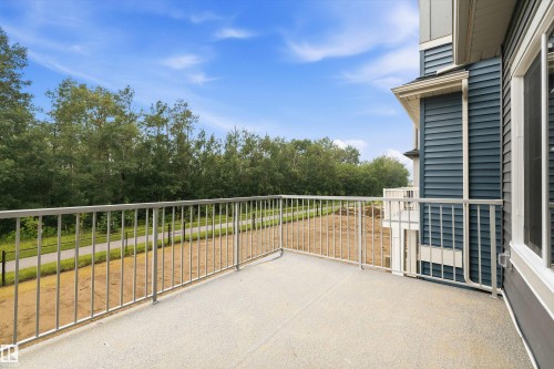 Spacious exterior balcony with a durable textured surface and contemporary metal railings - 919 Elderberry Landing Nw, Edmonton, AB - Outdoor With Exterior