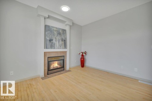 #41 1650 Towne Center Bv Nw, Edmonton, AB - Indoor Photo Showing Other Room With Fireplace
