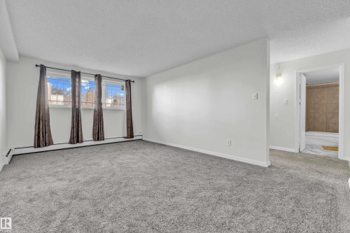 #105 10725 111St Nw, Edmonton, AB - Indoor Photo Showing Other Room