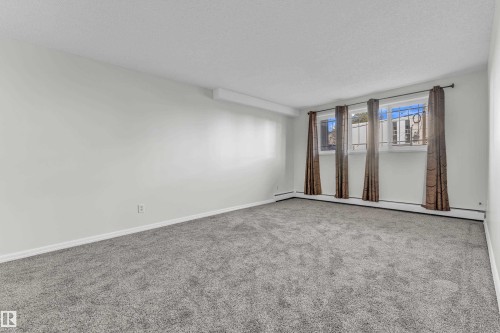 #105 10725 111St Nw, Edmonton, AB - Indoor Photo Showing Other Room