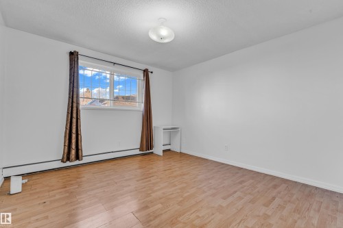 #105 10725 111St Nw, Edmonton, AB - Indoor Photo Showing Other Room