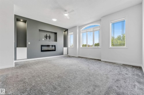 Living room - 16205 55 Street Nw, Edmonton, AB - Indoor With Fireplace