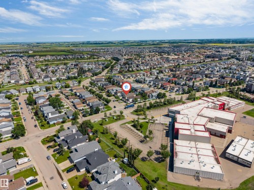 Aerial perspective of a residential neighborhood with paved streets and established homes - 16205 55 Street Nw, Edmonton, AB - Outdoor With View