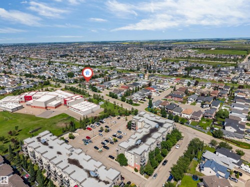 Residential neighborhood featuring a mix of single-family homes and multi-story apartment buildings - 16205 55 Street Nw, Edmonton, AB - Outdoor With View