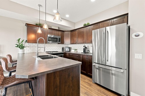 #117 7293 South Terwillegar Dr Nw, Edmonton, AB - Indoor Photo Showing Kitchen With Stainless Steel Kitchen With Double Sink With Upgraded Kitchen