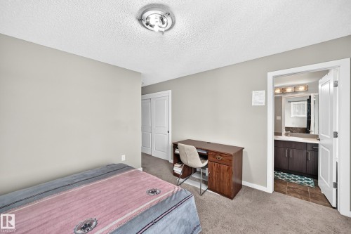 Light-toned walls with carpet flooring - #10 2803 James Mowatt Trail Sw, Edmonton, AB - Indoor