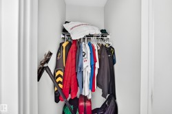 Recessed closet featuring a wire shelving system and hanging rod - 