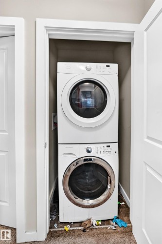 Image quality insufficient for description - #10 2803 James Mowatt Trail Sw, Edmonton, AB - Indoor Photo Showing Laundry Room
