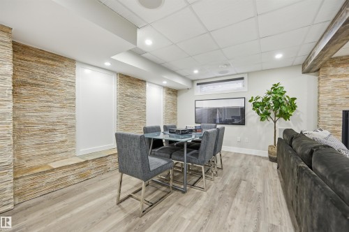 439 Rooney Crescent Nw, Edmonton, AB - Indoor Photo Showing Dining Room With Fireplace