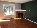 #133 5420 Grant Macewan Bv, Leduc, AB  - Indoor With Fireplace 