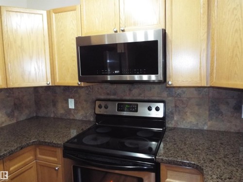 #133 5420 Grant Macewan Bv, Leduc, AB - Indoor Photo Showing Kitchen