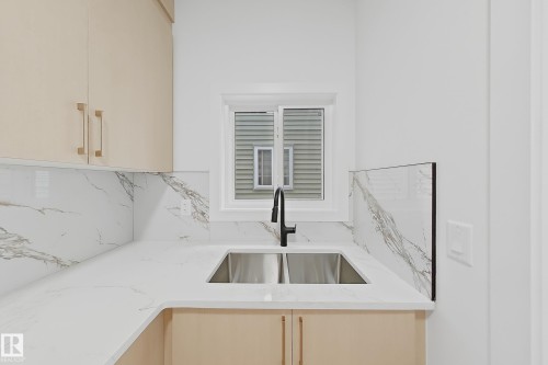 8916 Mayday Way Sw, Edmonton, AB - Indoor Photo Showing Kitchen With Double Sink