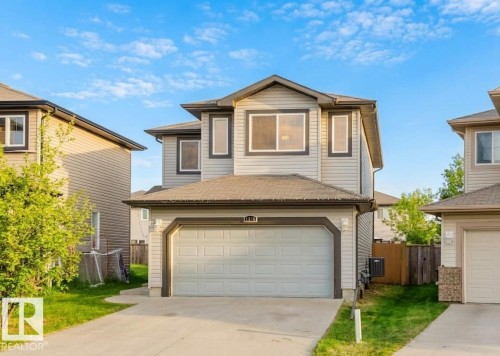 Two-story structure featuring light-toned siding and dark trim accents - 1919 Hammond Place, Edmonton, AB - Outdoor