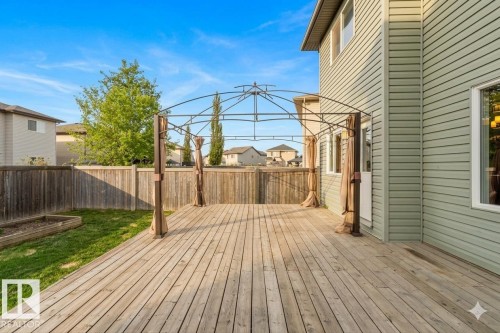 Expansive wood deck featuring a metal-framed gazebo structure with fabric accents - 1919 Hammond Place, Edmonton, AB - Outdoor With Deck Patio Veranda