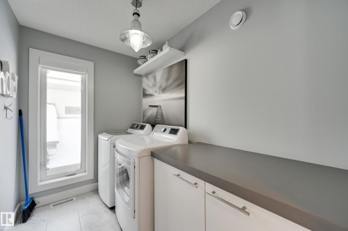 1311 Hainstock Way Sw, Edmonton, AB - Indoor Photo Showing Laundry Room