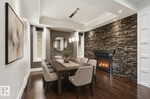 5216 Mullen Crest Nw, Edmonton, AB - Indoor Photo Showing Dining Room With Fireplace
