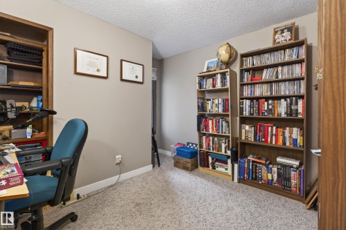 Room featuring light-colored wall paint and textured carpeting - 10 Abbey Crescent, St. Albert, AB - Indoor Photo Showing Office