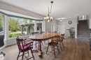 Bright dining area featuring a prominent bay window - 10 Abbey Crescent, St. Albert, AB  - Indoor Photo Showing Dining Room 