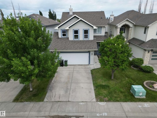 Two-story residence featuring light gray siding with blue trim accents and a shingle roof - 1820 Robertson Crescent Sw, Edmonton, AB - Outdoor With Facade