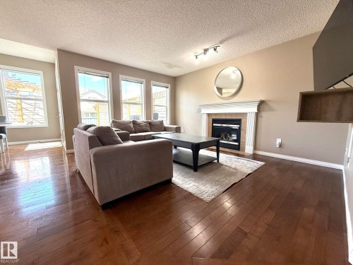 Living room - 1820 Robertson Crescent Sw, Edmonton, AB - Indoor Photo Showing Living Room With Fireplace