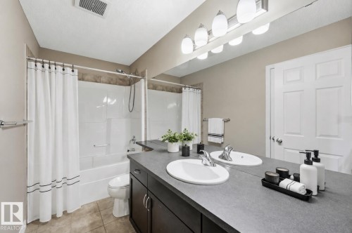 (virtually staged accessories) - 3528 Claxton Crescent Sw, Edmonton, AB - Indoor Photo Showing Bathroom