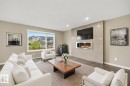(virtually staged furniture) - 3528 Claxton Crescent Sw, Edmonton, AB  - Indoor Photo Showing Living Room With Fireplace 