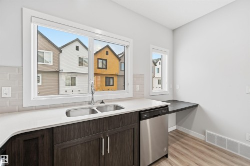 #80 1010 Rabbit Hill Rd Sw, Edmonton, AB - Indoor Photo Showing Kitchen With Double Sink