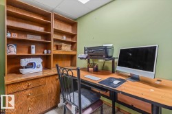 Built-in wood-finish shelving and cabinetry provide ample storage - 