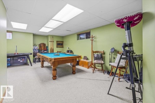 Finished basement space featuring light green walls, recessed lighting, and carpet flooring - 16 Harrold Place, St. Albert, AB - Indoor Photo Showing Other Room