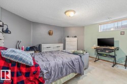 Bedroom featuring two-tone wall paint, recessed window, and overhead flush mount lighting - 
