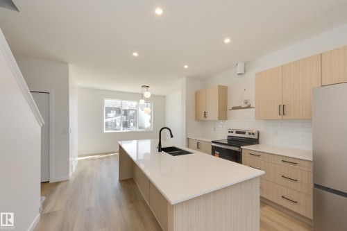 21007 25 Avenue Nw, Edmonton, AB - Indoor Photo Showing Kitchen With Double Sink With Upgraded Kitchen