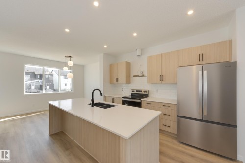 21007 25 Avenue Nw, Edmonton, AB - Indoor Photo Showing Kitchen With Double Sink With Upgraded Kitchen