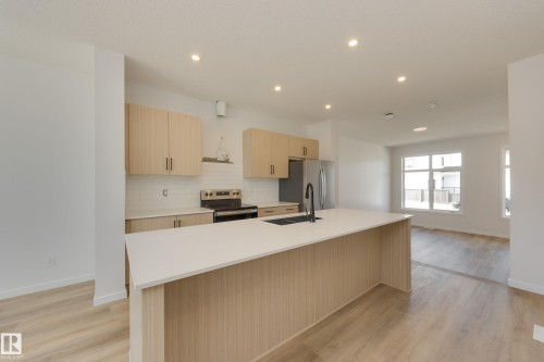 21007 25 Avenue Nw, Edmonton, AB - Indoor Photo Showing Kitchen With Double Sink
