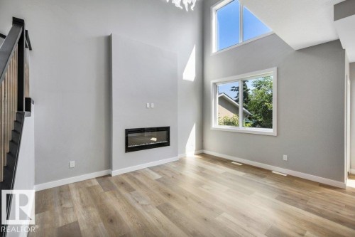 3813 104 Street Nw, Edmonton, AB - Indoor Photo Showing Living Room With Fireplace