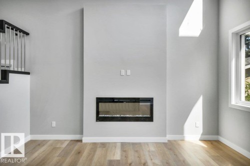 3813 104 Street Nw, Edmonton, AB - Indoor Photo Showing Living Room With Fireplace