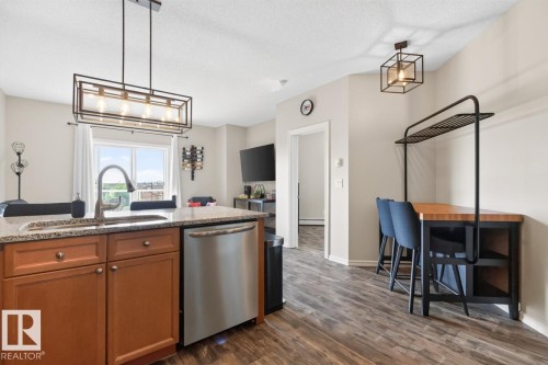 #313 226 Macewan Rd Sw, Edmonton, AB - Indoor Photo Showing Kitchen With Stainless Steel Kitchen
