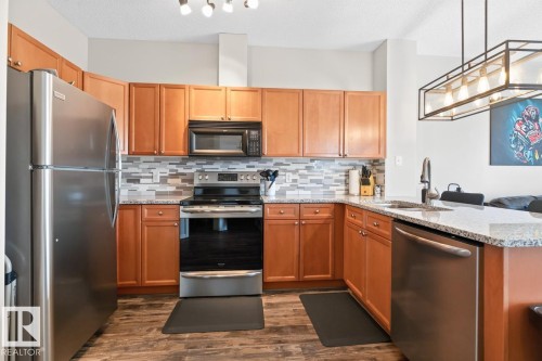 #313 226 Macewan Rd Sw, Edmonton, AB - Indoor Photo Showing Kitchen With Stainless Steel Kitchen