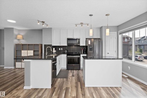128 3305 Orchards Link, Edmonton, AB - Indoor Photo Showing Kitchen With Stainless Steel Kitchen With Upgraded Kitchen
