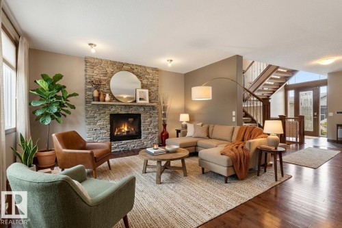 Virtually staged, this photo depicts the possibilities - 25 Hilltop Ridge, Fort Saskatchewan, AB - Indoor Photo Showing Living Room With Fireplace