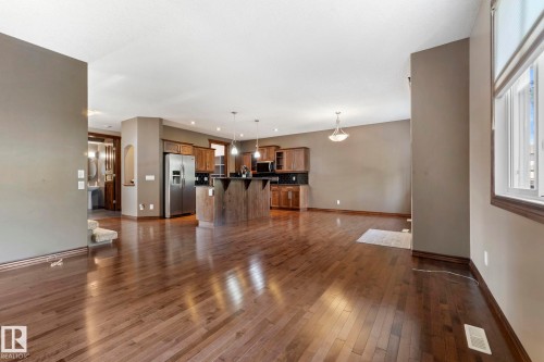 View from living room into the kitchen and dining area - 25 Hilltop Ridge, Fort Saskatchewan, AB - Indoor Photo Showing Other Room