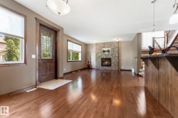 This photo shows the living room looking from the dining area - 