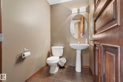 2 piece powder room on the main floor - 25 Hilltop Ridge, Fort Saskatchewan, AB - Indoor Photo Showing Bathroom