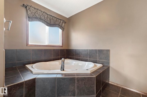 Relax in the corner jetted tub - 25 Hilltop Ridge, Fort Saskatchewan, AB - Indoor Photo Showing Bathroom