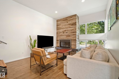 8751 83 Avenue Nw, Edmonton, AB - Indoor Photo Showing Living Room With Fireplace