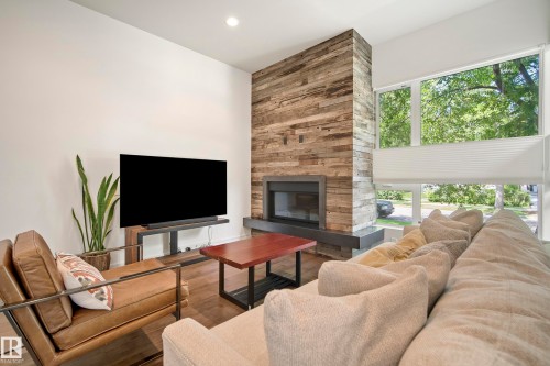 8751 83 Avenue Nw, Edmonton, AB - Indoor Photo Showing Living Room With Fireplace